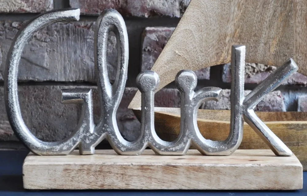Deko-Aufsteller mit Metallschrift "GLÜCK" Schriftzug